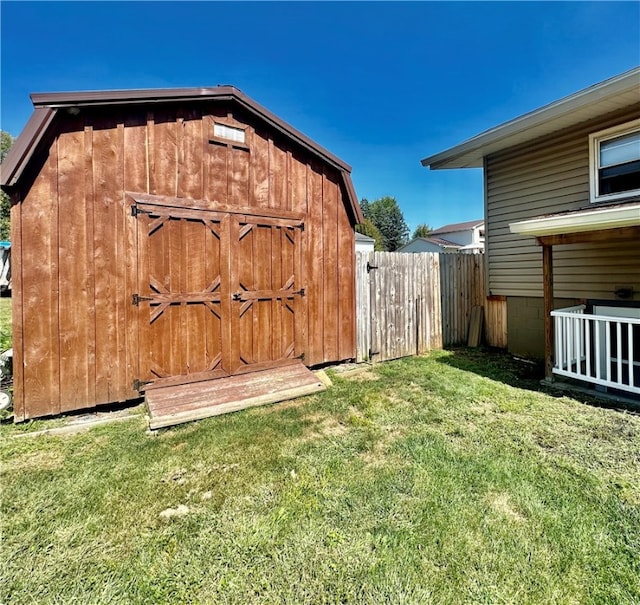 view of outbuilding with a yard