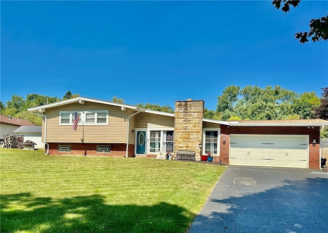 view of front facade featuring a front lawn and a garage