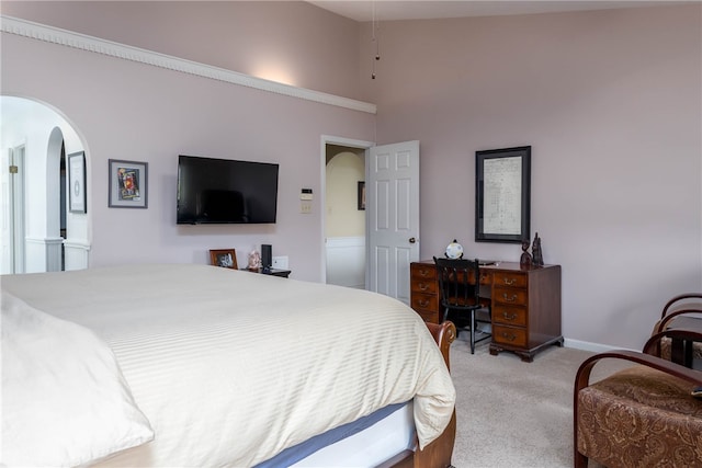 bedroom featuring high vaulted ceiling and carpet floors