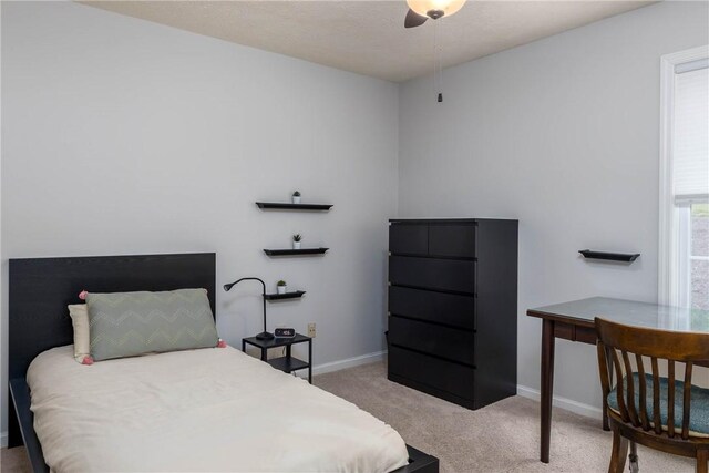 bedroom featuring ceiling fan and carpet floors