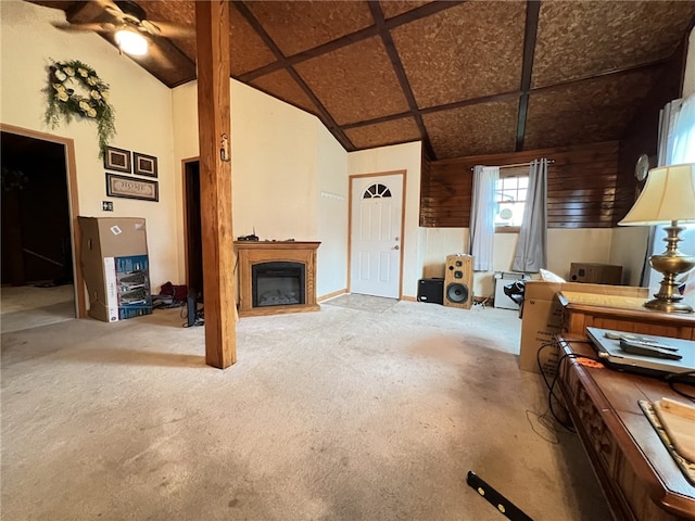 living room featuring carpet flooring and high vaulted ceiling