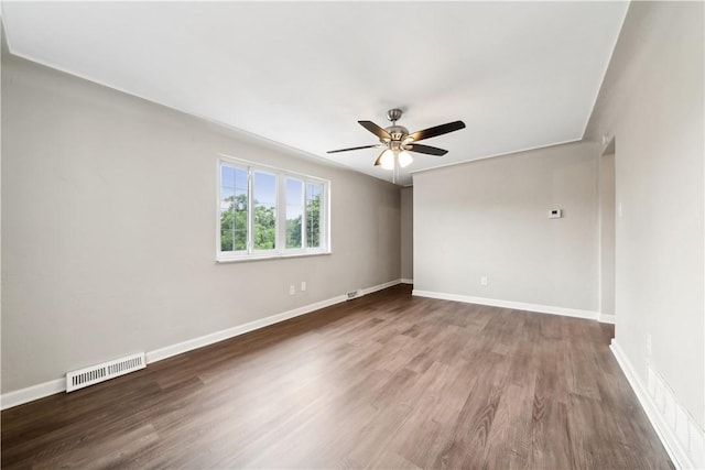 empty room with ceiling fan and wood-type flooring