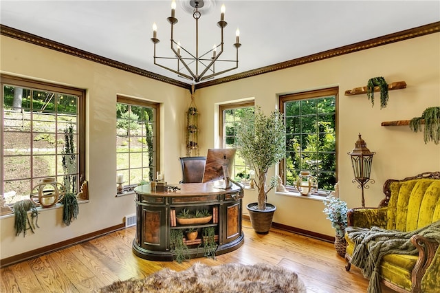 office area with an inviting chandelier, ornamental molding, and hardwood / wood-style flooring