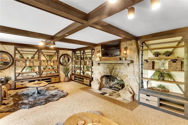 carpeted living room featuring beamed ceiling, coffered ceiling, and a fireplace