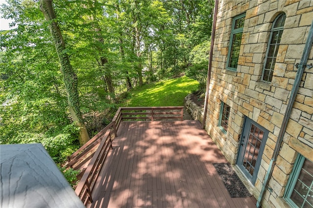 wooden terrace with a yard