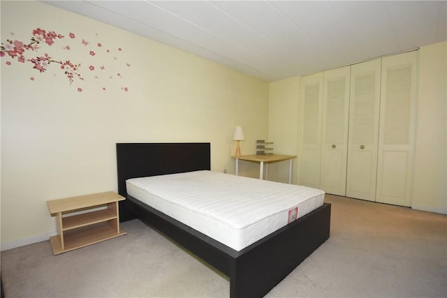 carpeted bedroom featuring a closet