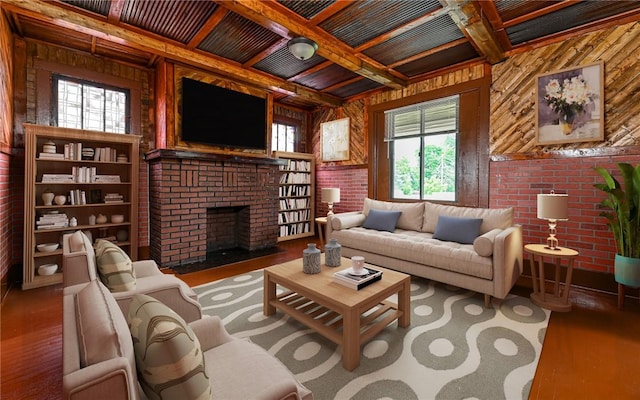 living room featuring brick wall, coffered ceiling, hardwood / wood-style floors, and a brick fireplace