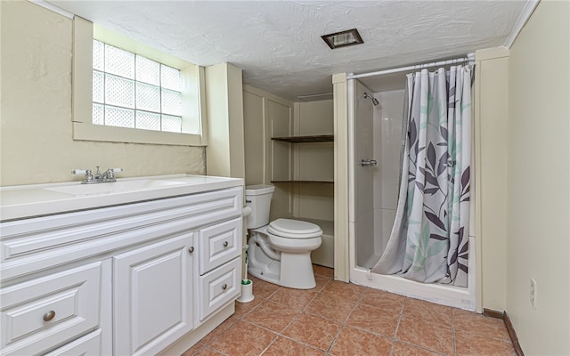 bathroom with tile flooring, vanity with extensive cabinet space, a shower with curtain, a textured ceiling, and toilet