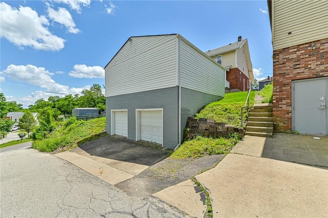 view of side of property featuring a garage