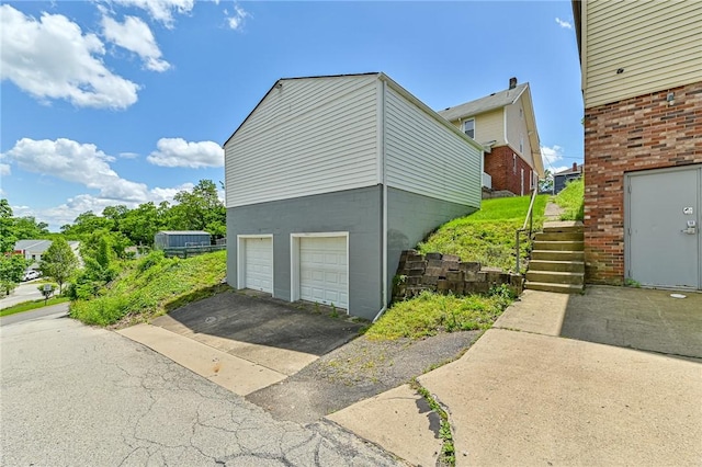 view of side of home with a garage