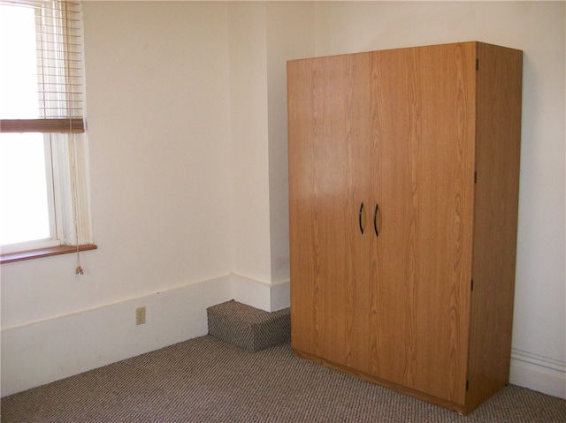 unfurnished bedroom with carpet floors