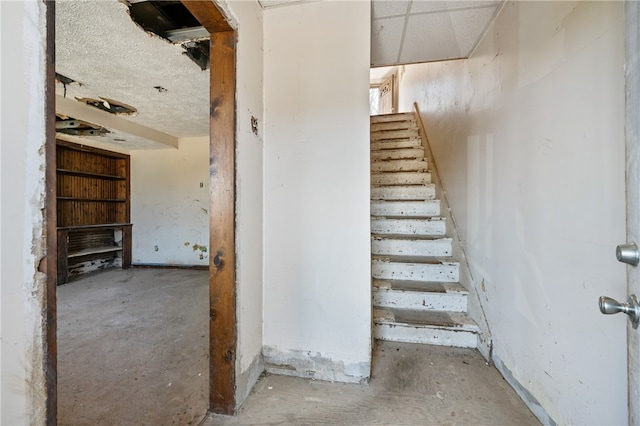 stairs with concrete floors