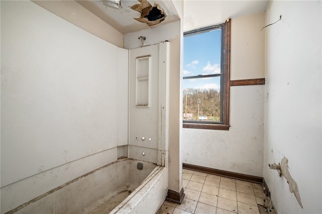 bathroom featuring tile floors and shower / washtub combination