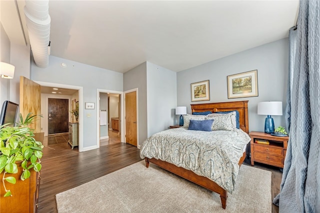 bedroom featuring dark hardwood / wood-style flooring