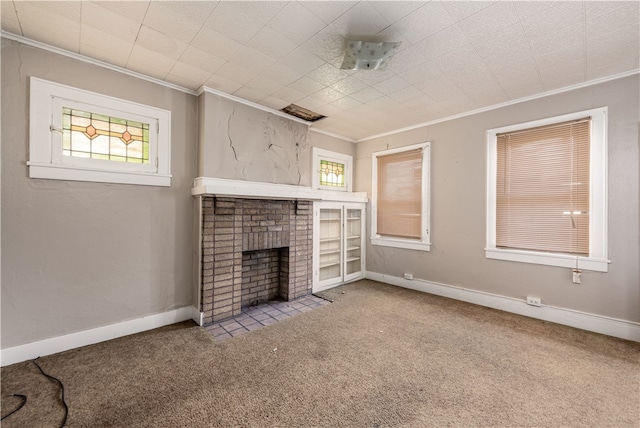 unfurnished living room featuring ornamental molding, carpet, and a brick fireplace