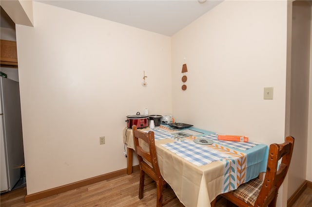 dining space featuring hardwood / wood-style floors