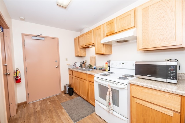 kitchen with sink, white electric range, light wood-type flooring, and light brown cabinetry