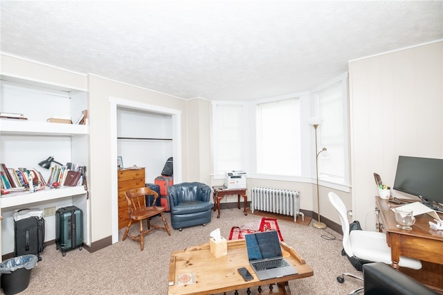 living room featuring a textured ceiling, carpet flooring, and radiator