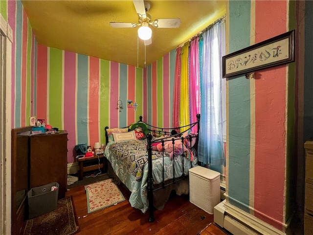 bedroom featuring ceiling fan and hardwood / wood-style floors