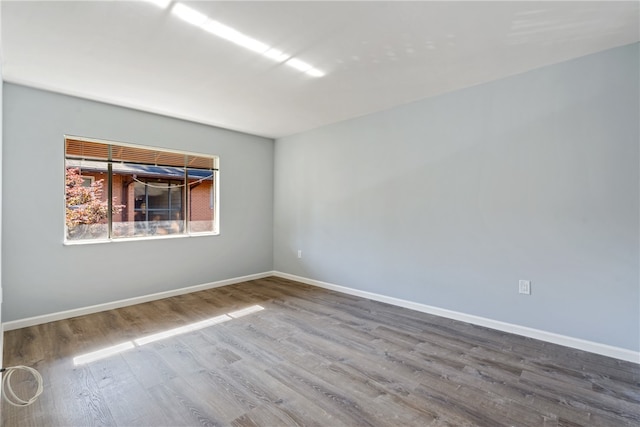 empty room featuring hardwood / wood-style flooring