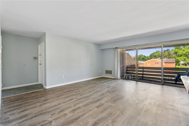 unfurnished living room featuring hardwood / wood-style floors