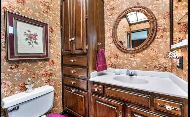 bathroom with oversized vanity and toilet