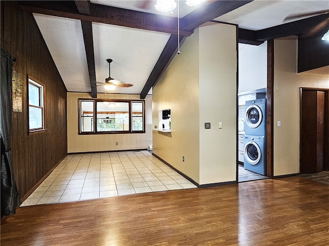 interior space featuring wooden walls, ceiling fan, vaulted ceiling with beams, and hardwood / wood-style flooring