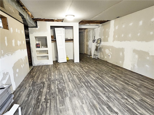 basement featuring dark hardwood / wood-style floors