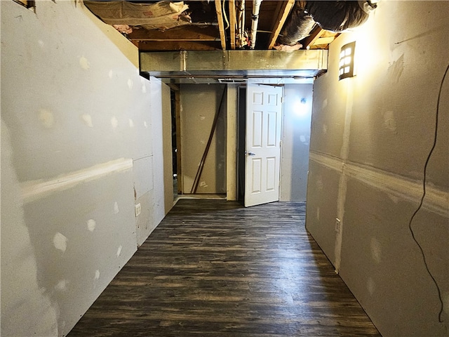 basement featuring dark hardwood / wood-style flooring