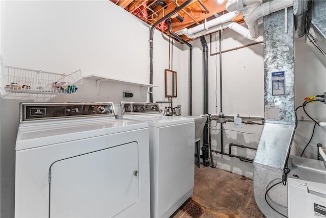 laundry room with separate washer and dryer