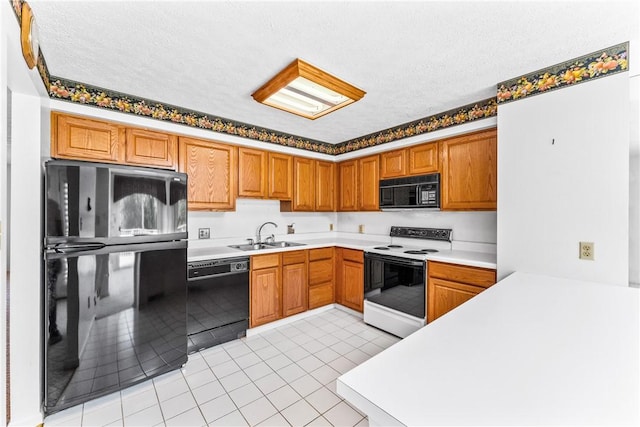 kitchen with sink, light tile patterned floors, a textured ceiling, and black appliances