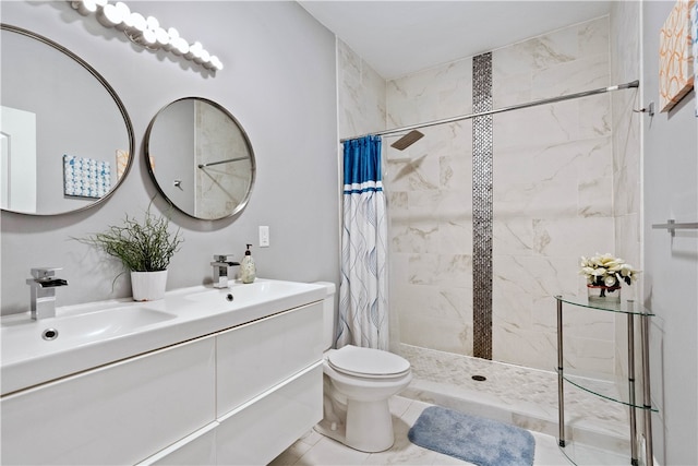 bathroom featuring tile patterned flooring, a shower with curtain, vanity, and toilet