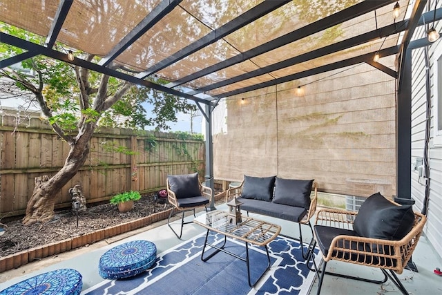 view of patio featuring an outdoor hangout area and a pergola