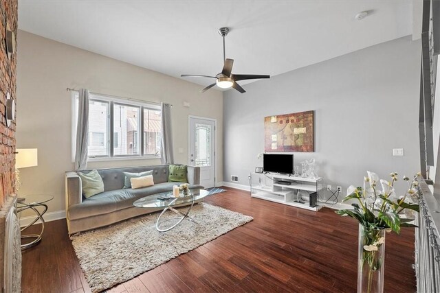 living room with ceiling fan and wood-type flooring