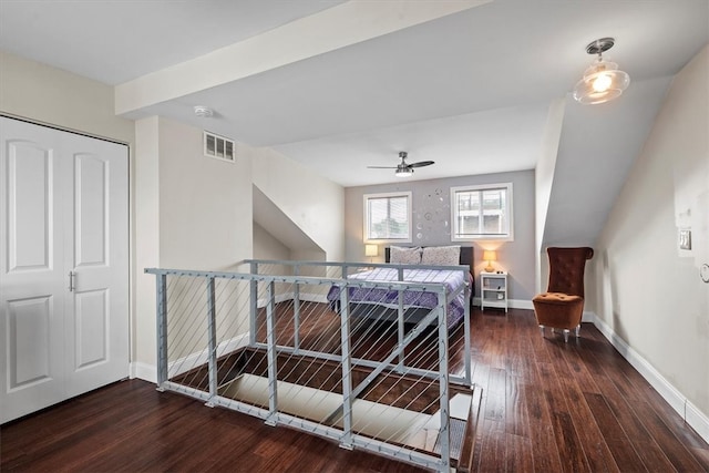 bedroom featuring ceiling fan, a closet, and dark hardwood / wood-style floors