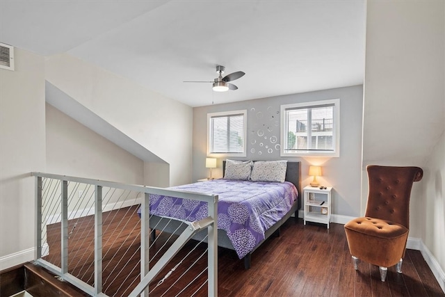 bedroom with ceiling fan and dark hardwood / wood-style floors