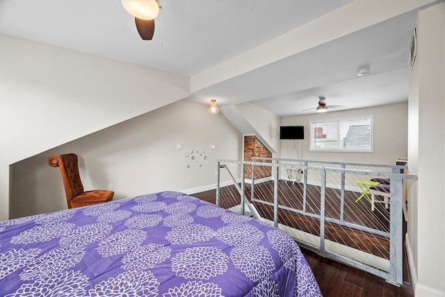 bedroom featuring hardwood / wood-style floors, ceiling fan, and lofted ceiling