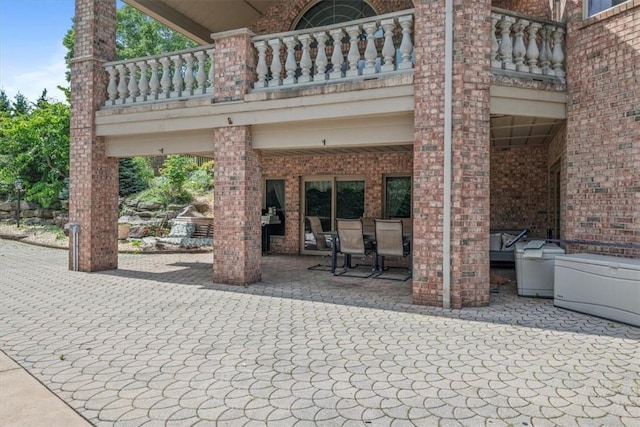 view of patio with a balcony