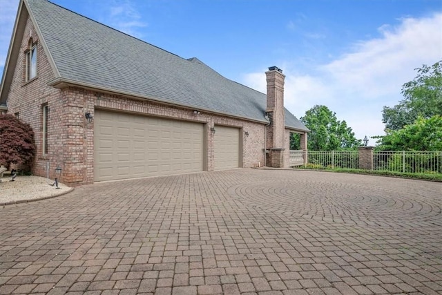 view of side of home with a garage