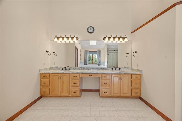 bathroom with tile patterned flooring, vanity, and an enclosed shower