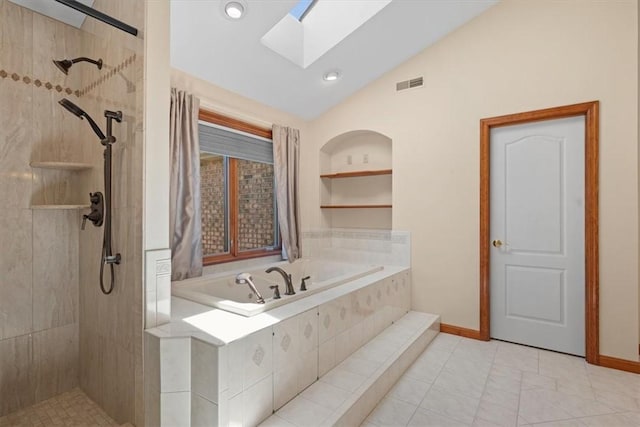 bathroom with built in shelves, vaulted ceiling with skylight, and shower with separate bathtub