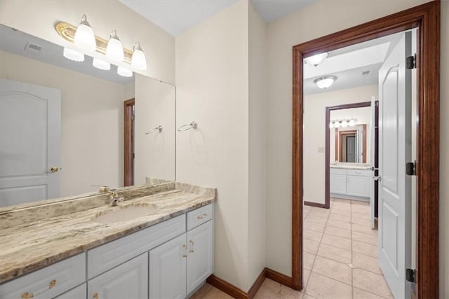 bathroom with vanity and tile patterned floors