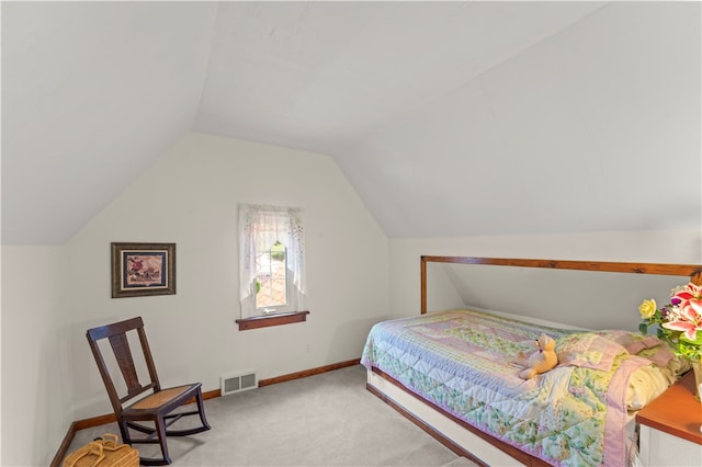 bedroom featuring carpet flooring and lofted ceiling