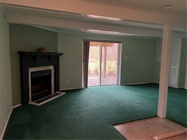 unfurnished living room with crown molding and light carpet