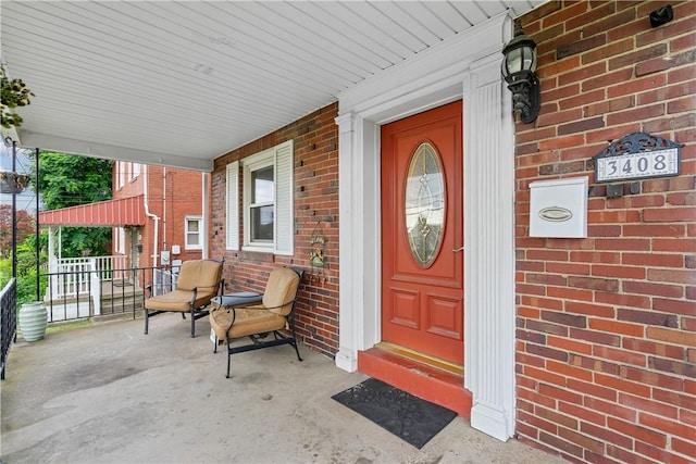 doorway to property featuring covered porch