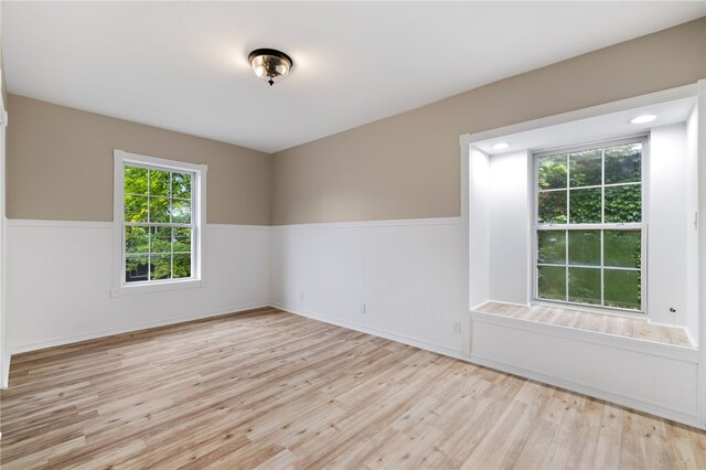 unfurnished room with light hardwood / wood-style floors