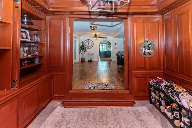 details with wood-type flooring, ornamental molding, and ceiling fan