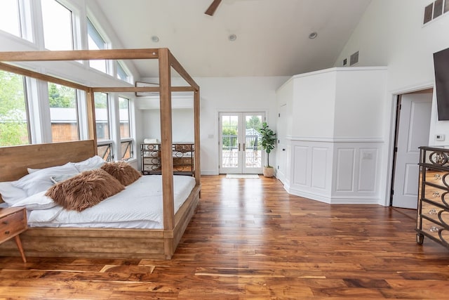 bedroom with ceiling fan, french doors, hardwood / wood-style floors, access to outside, and high vaulted ceiling