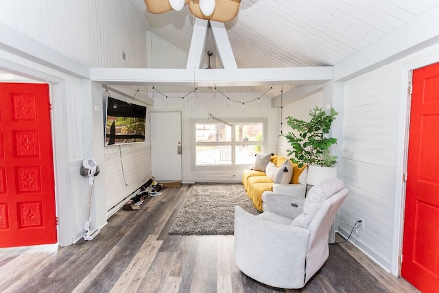 living area with dark wood-type flooring, vaulted ceiling with beams, and ceiling fan