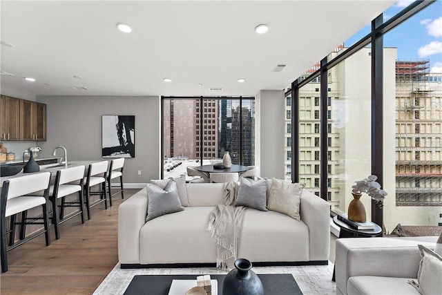 350 Oliver Ave Unit 1102, Downtown Pgh, PA 15222 - living area with hardwood / wood-style floors, recessed lighting, healthy amount of natural light, and a wall of windows